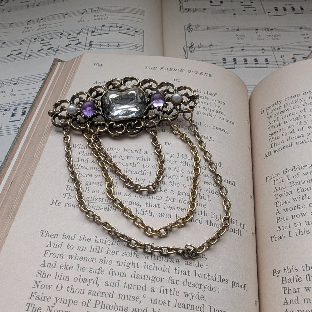 Vintage Gothic Gold Tone Brooch with Clear and Purple Stones